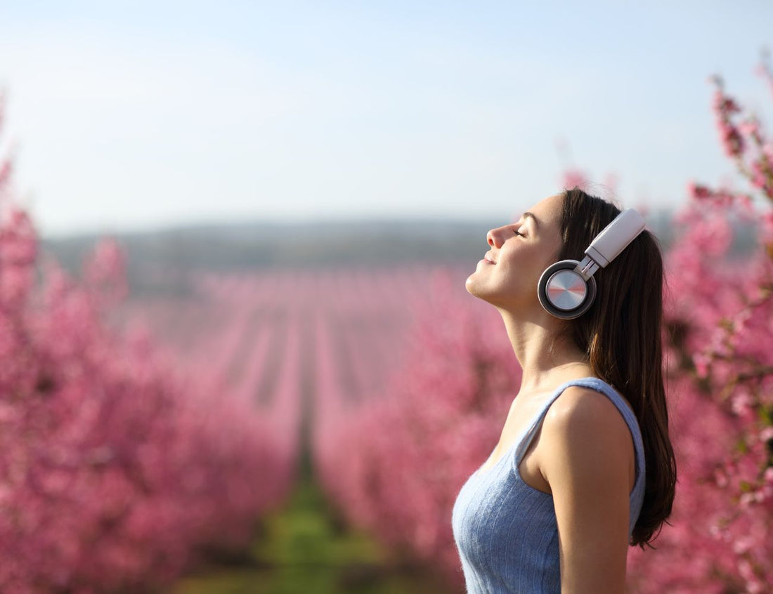 Women stood in a blossom field in spring