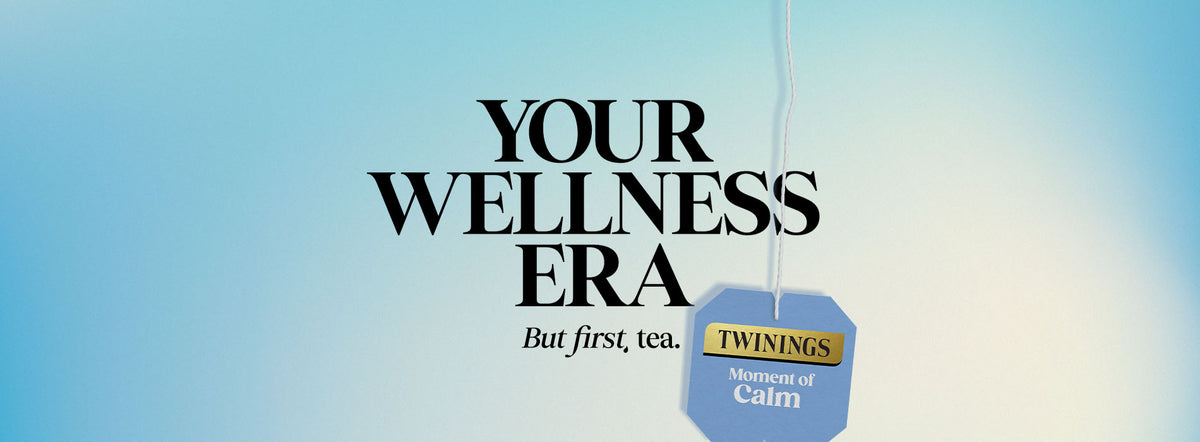 A promotional graphic with the text 'YOUR WELLNESS ERA' and 'But first, tea.' on a soft blue gradient background, with a hanging tea tag reading 'TWININGS Moment of Calm.