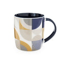 Barrel mug with abstract geometric pattern in navy, ochre, grey and cream, with dark navy handle and interior.