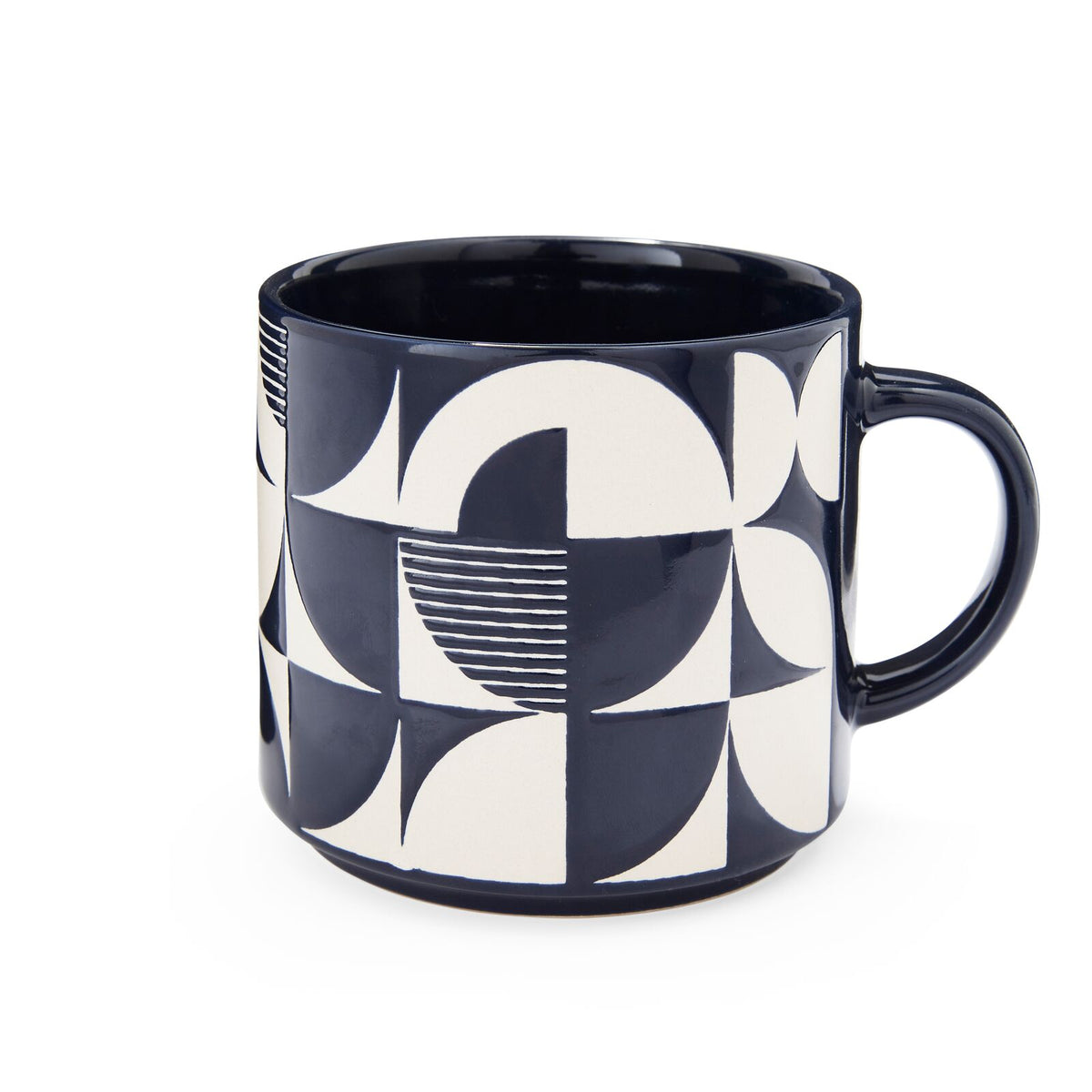 Stoneware mug with navy and white geometric pattern, glossy glaze and rounded handle.