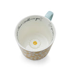Mug with yellow and white daisy design, soft blue handle and ‘If you were a flower, I would pick you’ message inside.