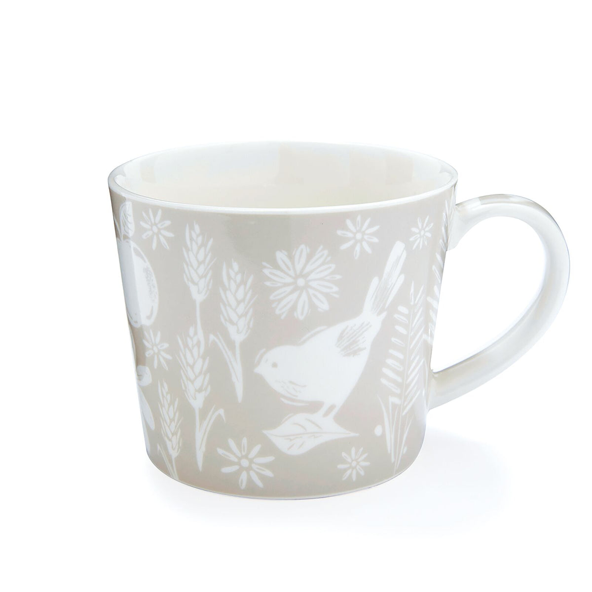 Soft neutral beige mug with tonal bird silhouette, floral and botanical motifs, and tapered shape.