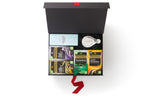 Timeless Black Tea Classic gift box with black tea, tea tidy, and Cartwright & Butler biscuits, inside black and white box with red ribbon 