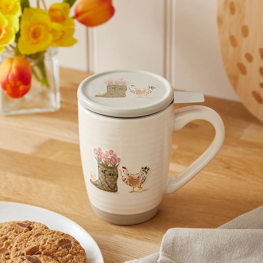 Infuser mug with garden planter and hen illustration, stainless steel tea infuser and matching lid that doubles as a drip tray.